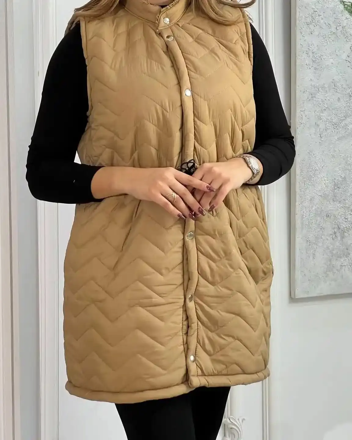 Manteau long sans manches d’hiver